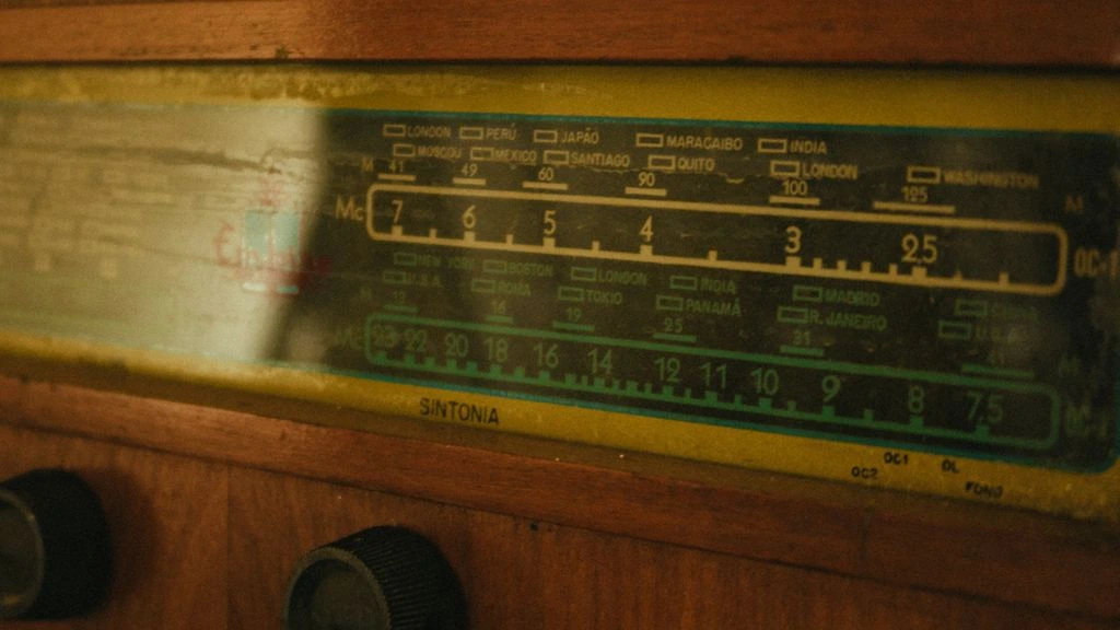 Vintage radio dial glowing in a dim Havana apartment