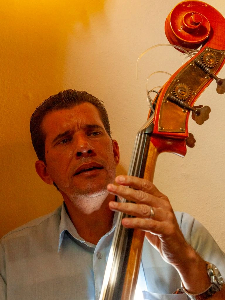 Rafael 'El Chivo' Mendoza leading the resident eleven-piece timba orchestra on stage